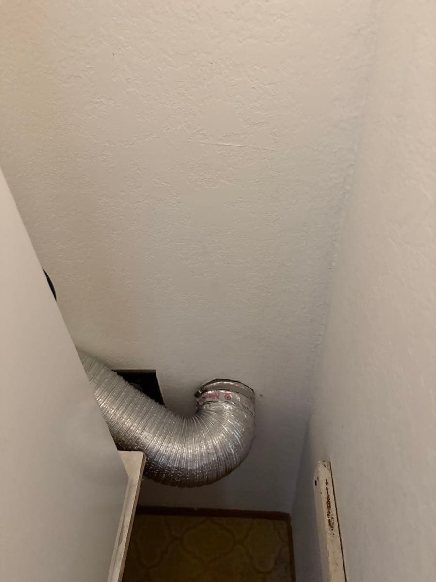 Clean dryer vent ductwork after professional cleaning, with clear interior passage and removed lint buildup
