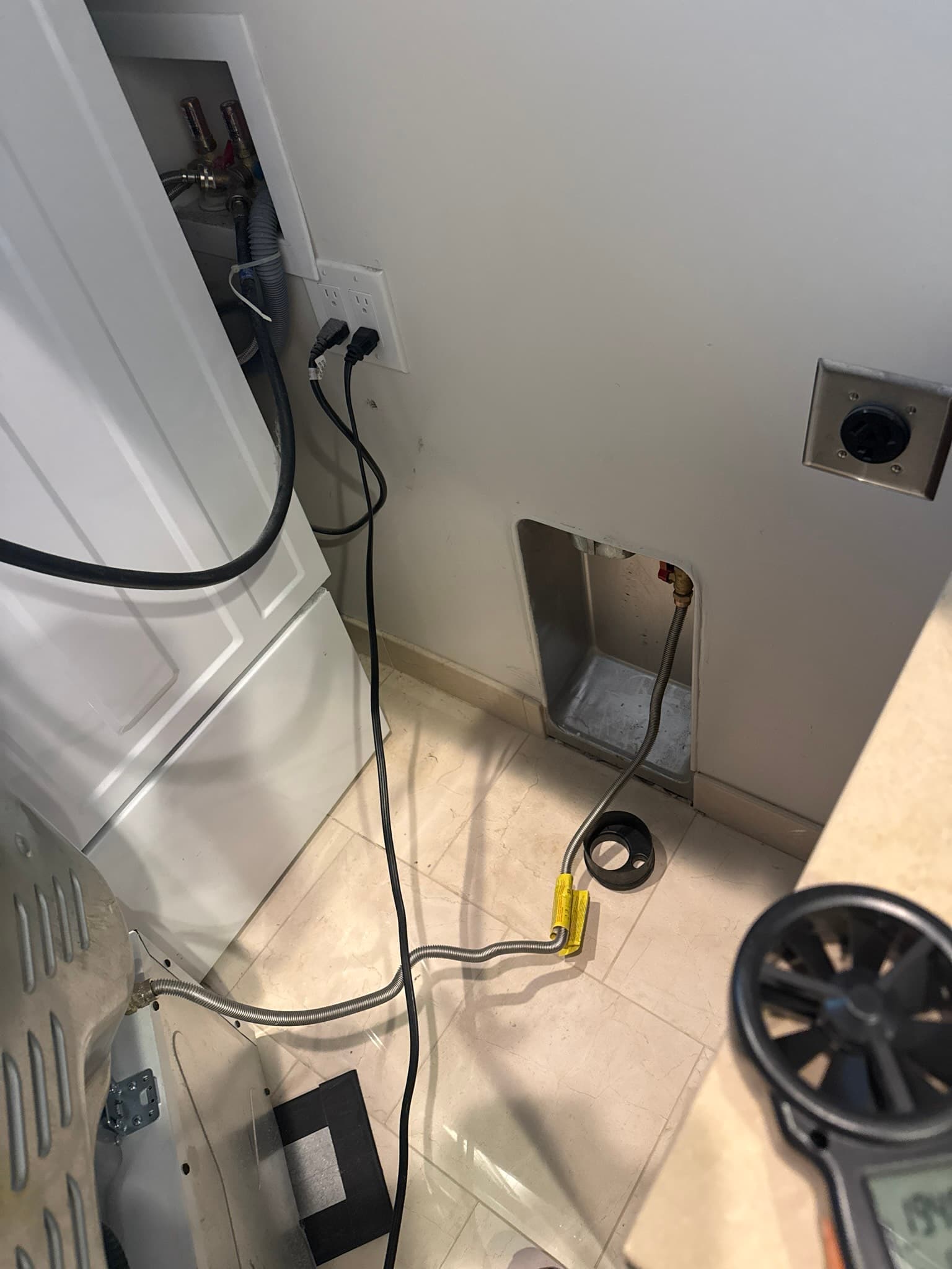 Dryer vent service in progress at a Redwood City residential property, showing the work area near the dryer installation