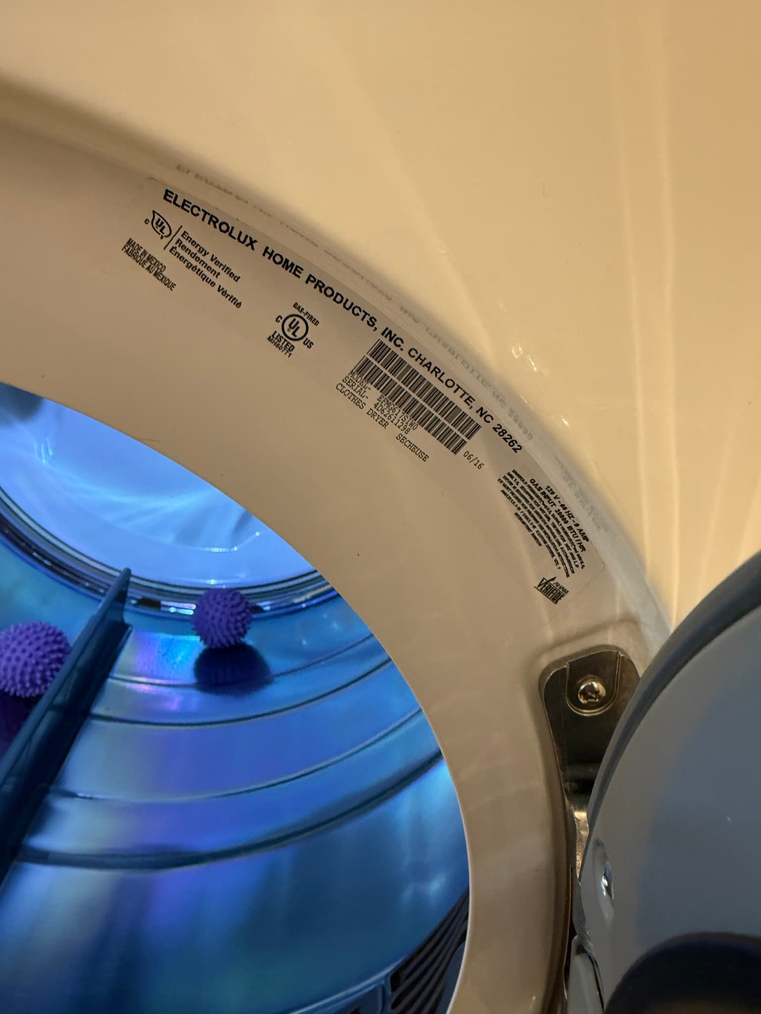 Close-up view of dryer vent ductwork and connection point during a professional cleaning service in Redwood City