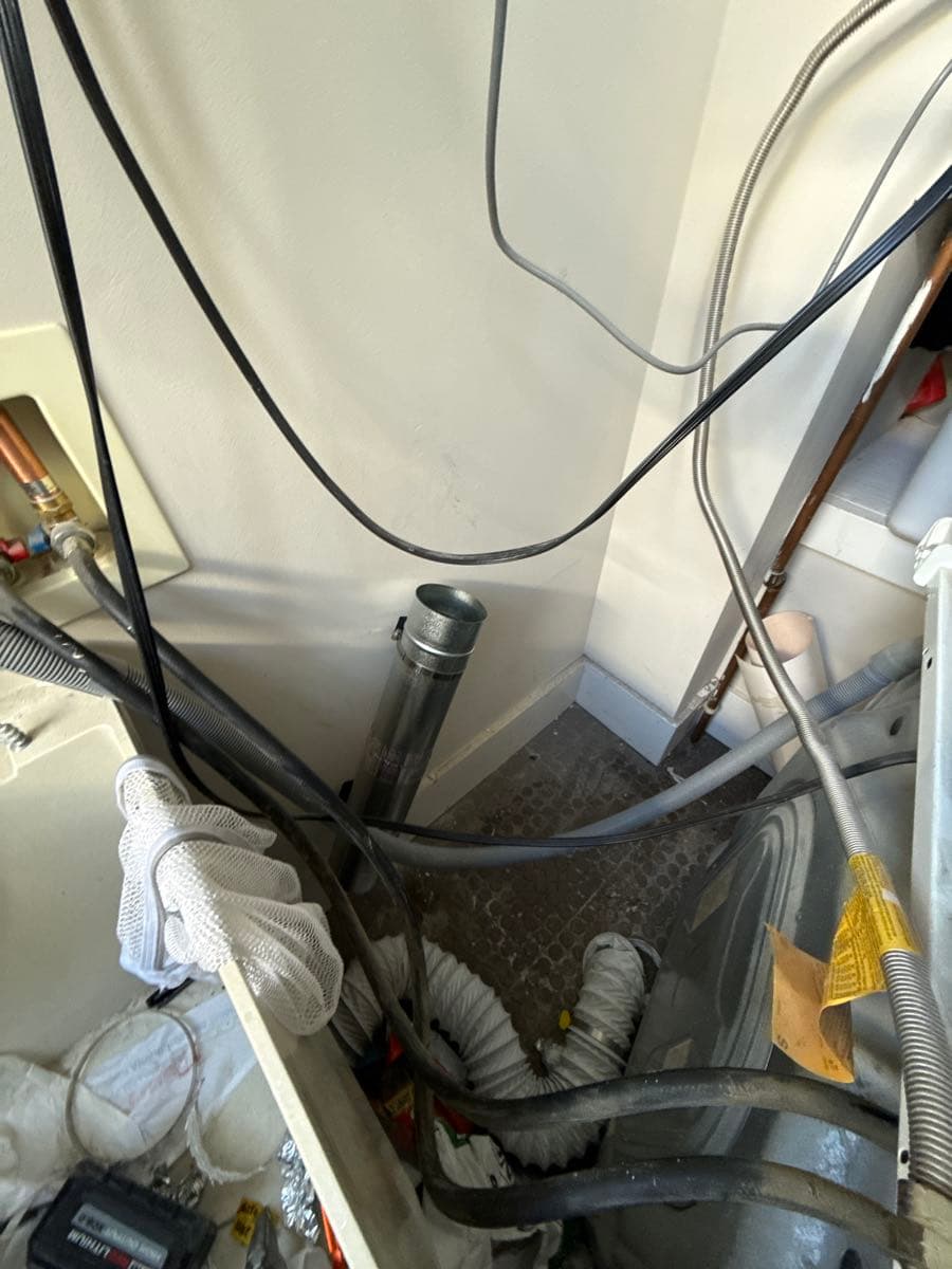 Dryer vent ductwork installation showing proper connections and fittings