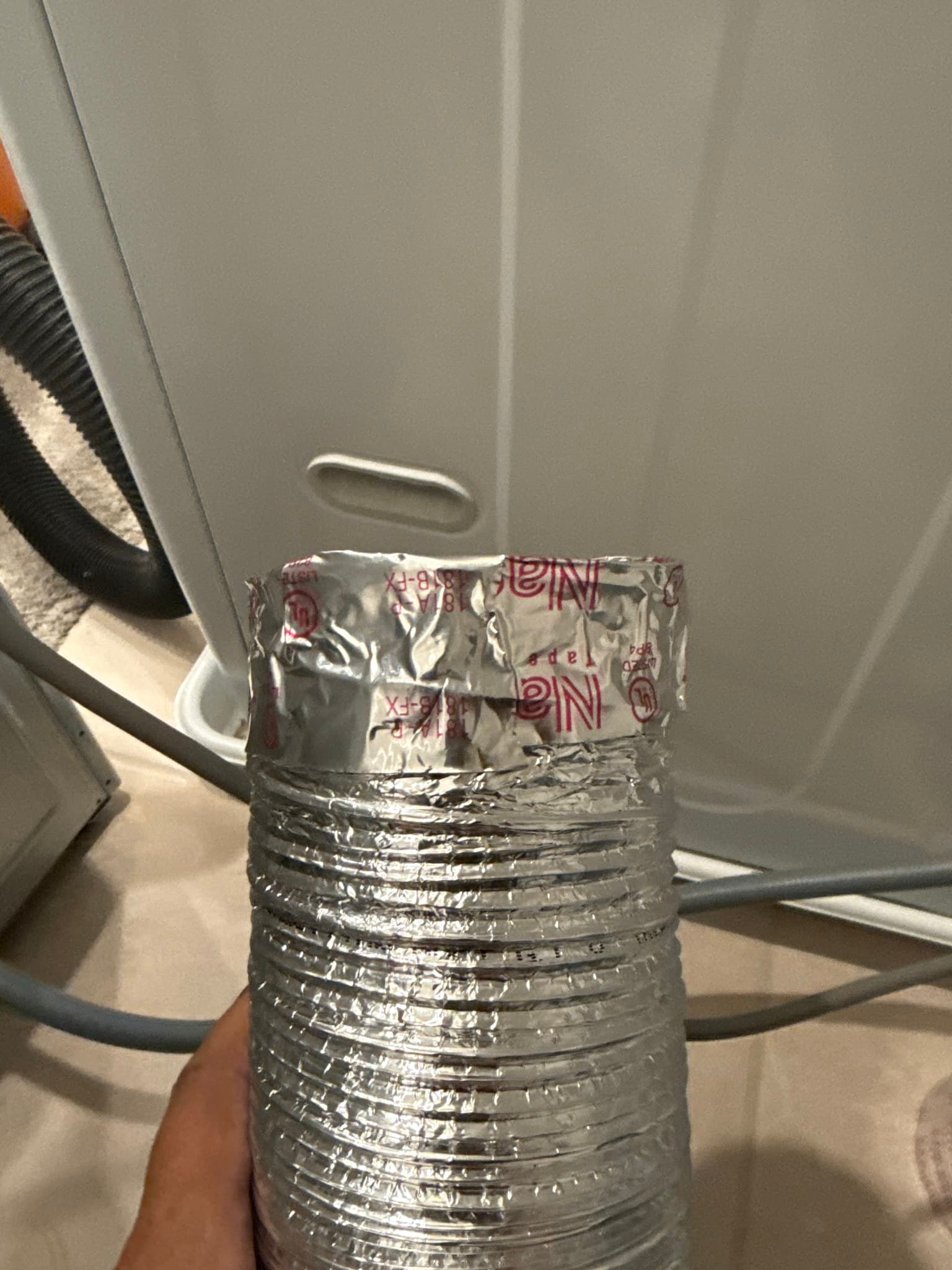 New UL 2158A fire-rated transition duct installed with proper tape sealing and hose clamp connections for safety compliance