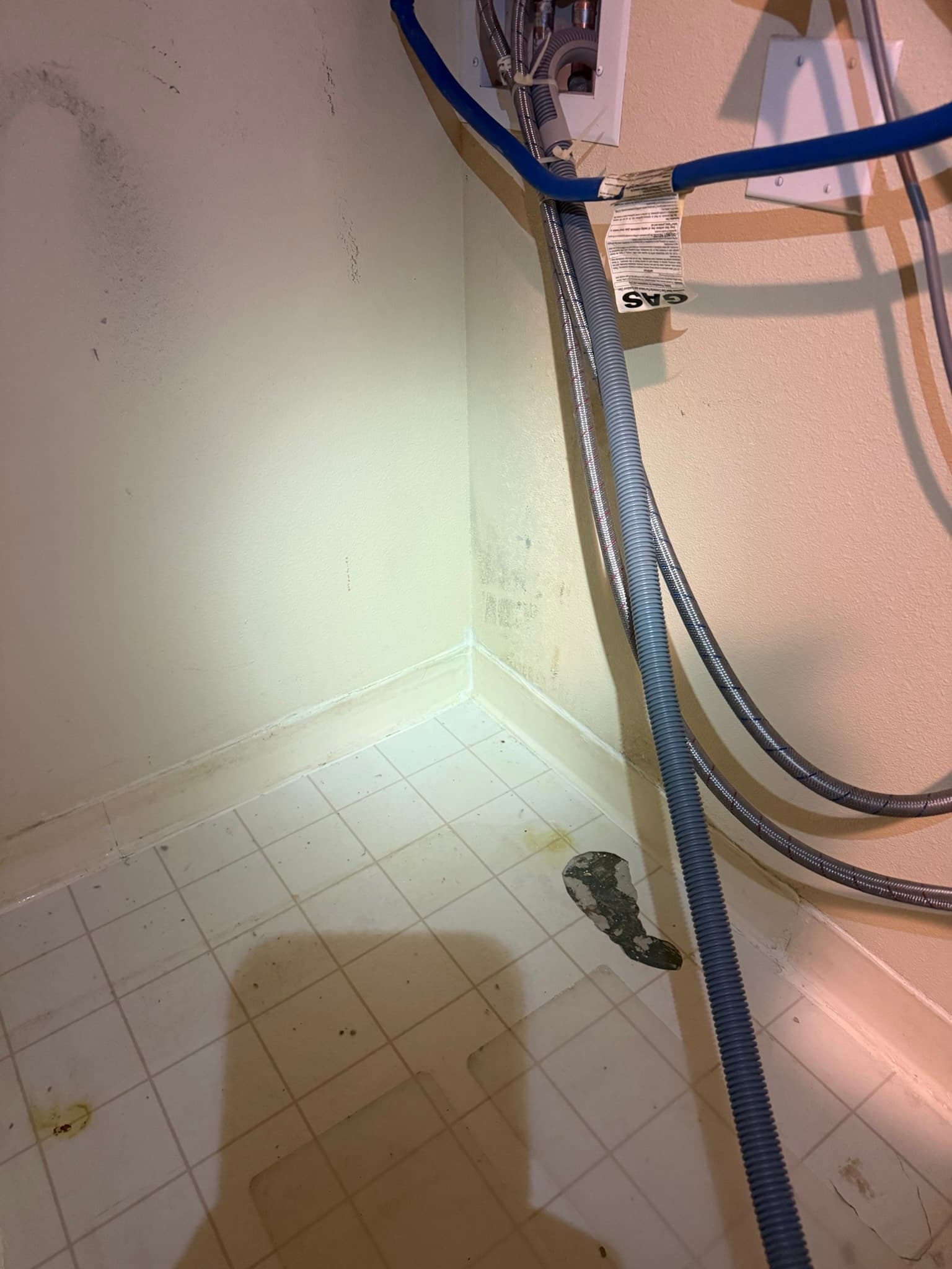 Rotary brush cleaning tool being used to remove lint accumulation from a residential dryer exhaust duct