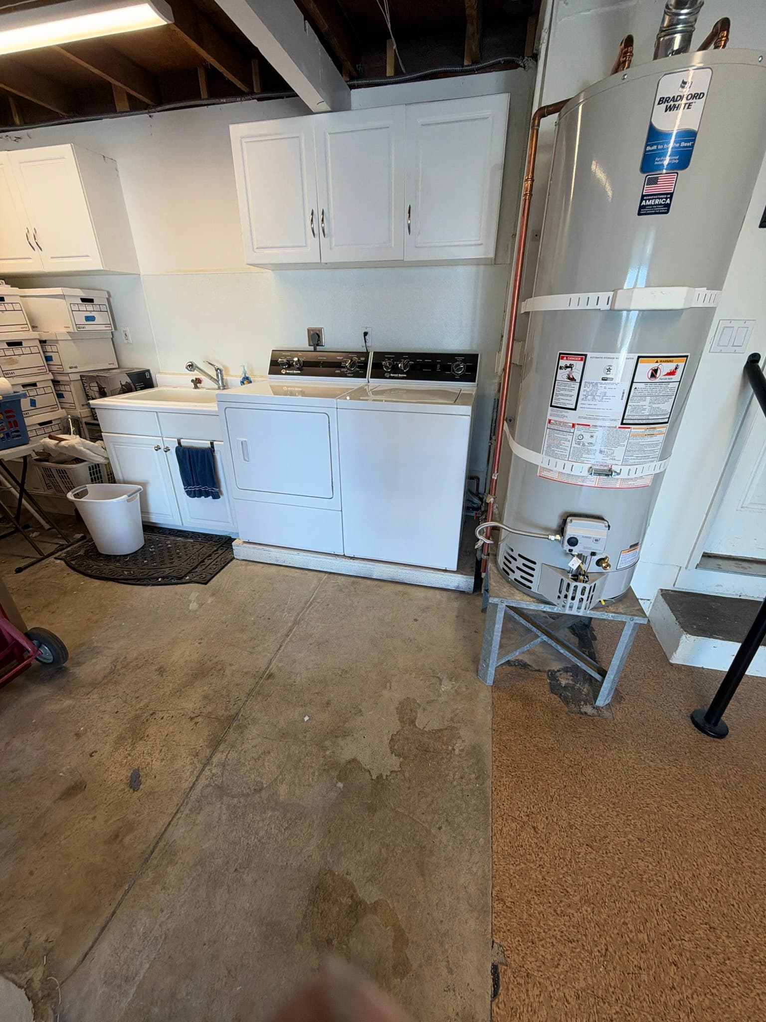 Technician inspecting the dryer connection point after completing the exhaust cleaning and airflow test