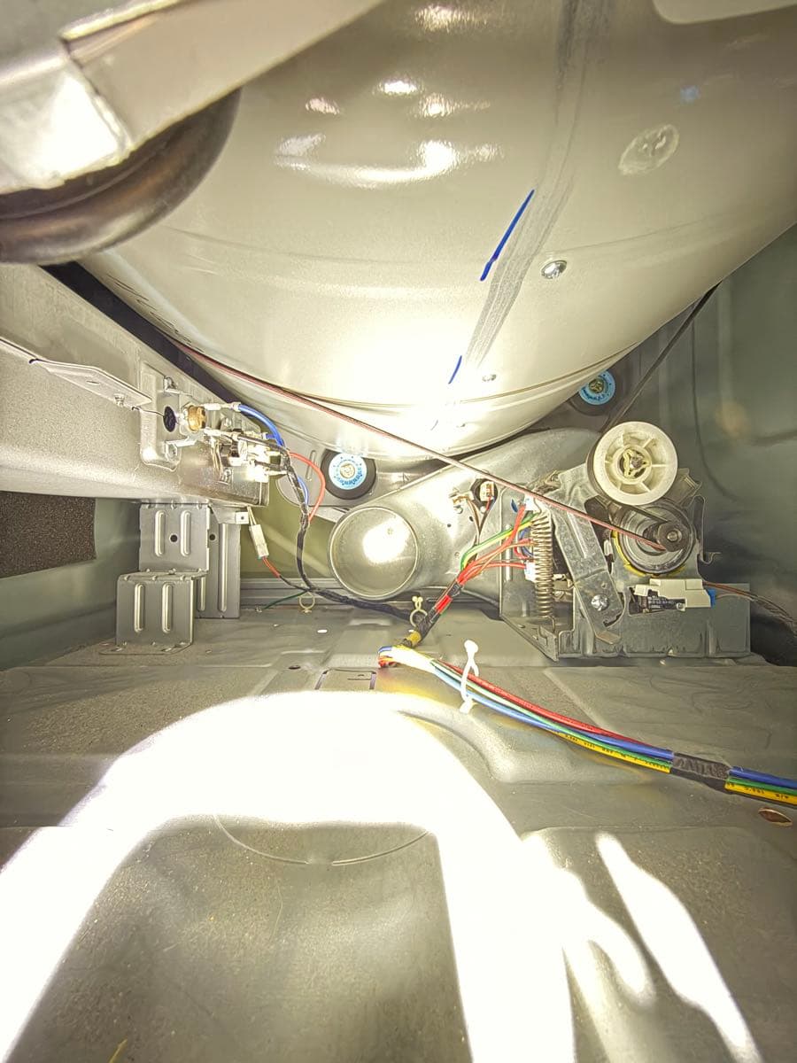 Interior view of dryer exhaust duct showing lint accumulation before cleaning