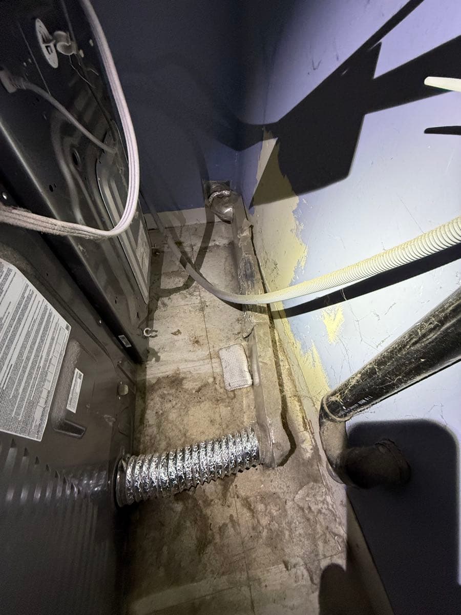Dryer exhaust system components laid out during repair and cleaning process