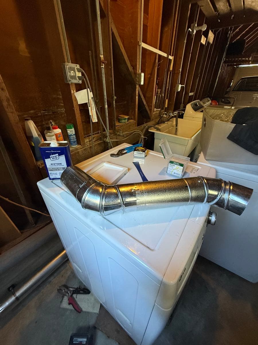 General view of the completed dryer exhaust installation work area