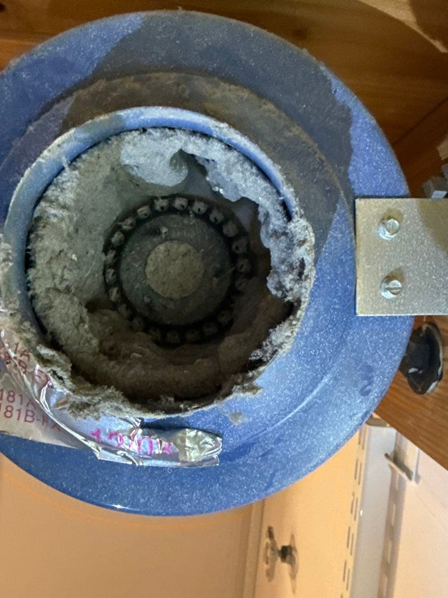Professional dryer vent cleaning process in progress