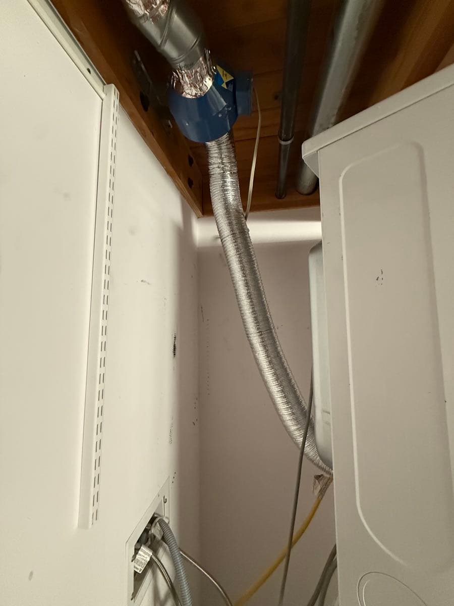 After cleaning: clear dryer vent duct with restored airflow pathway