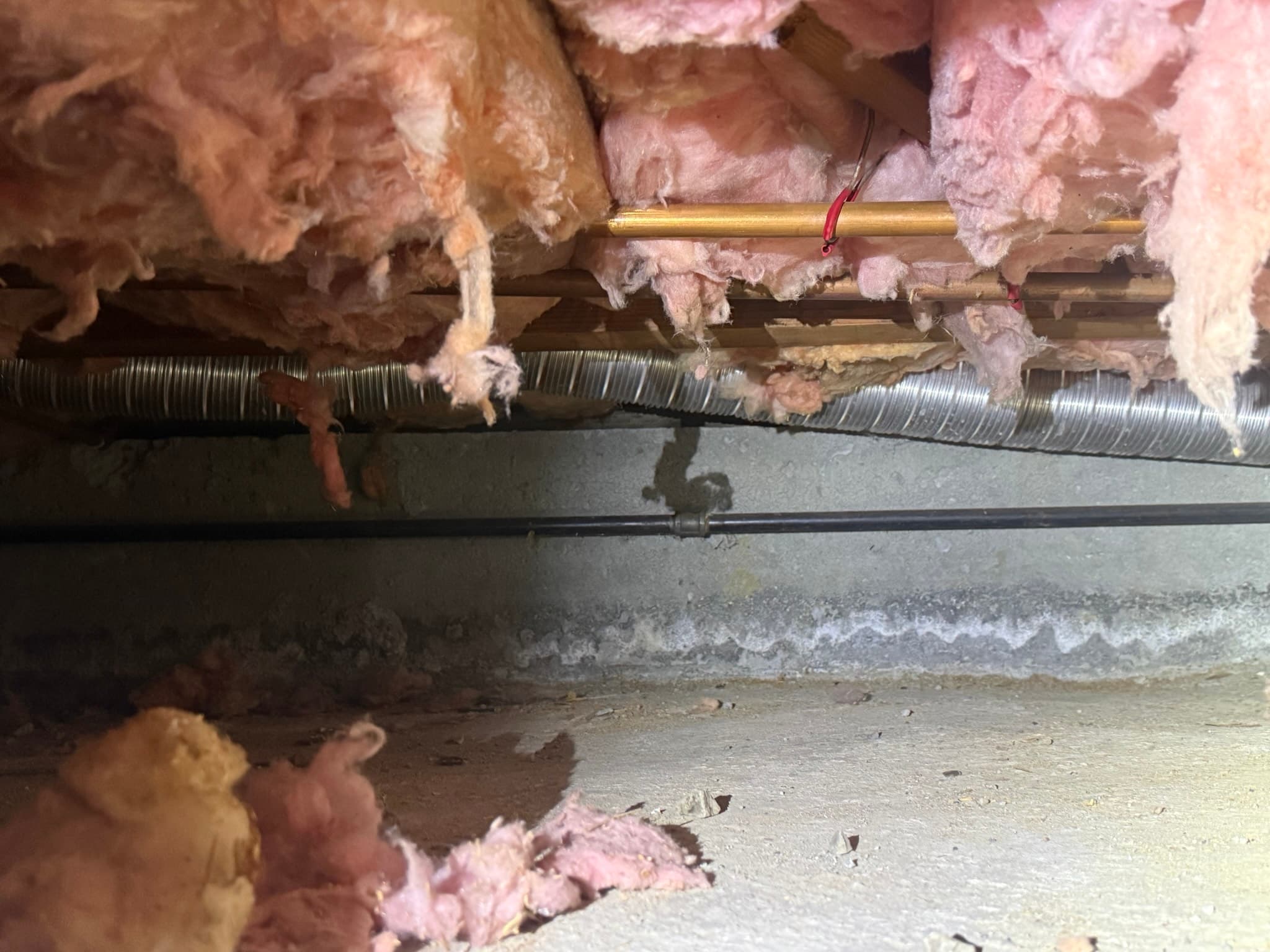 View of the dryer installation area showing the connection point between the dryer and the exhaust duct