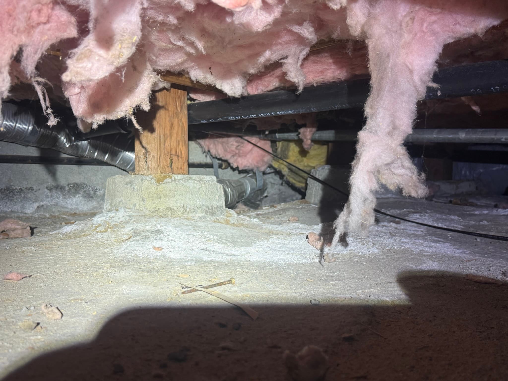 Close-up of lint accumulation inside the dryer exhaust duct during the cleaning process