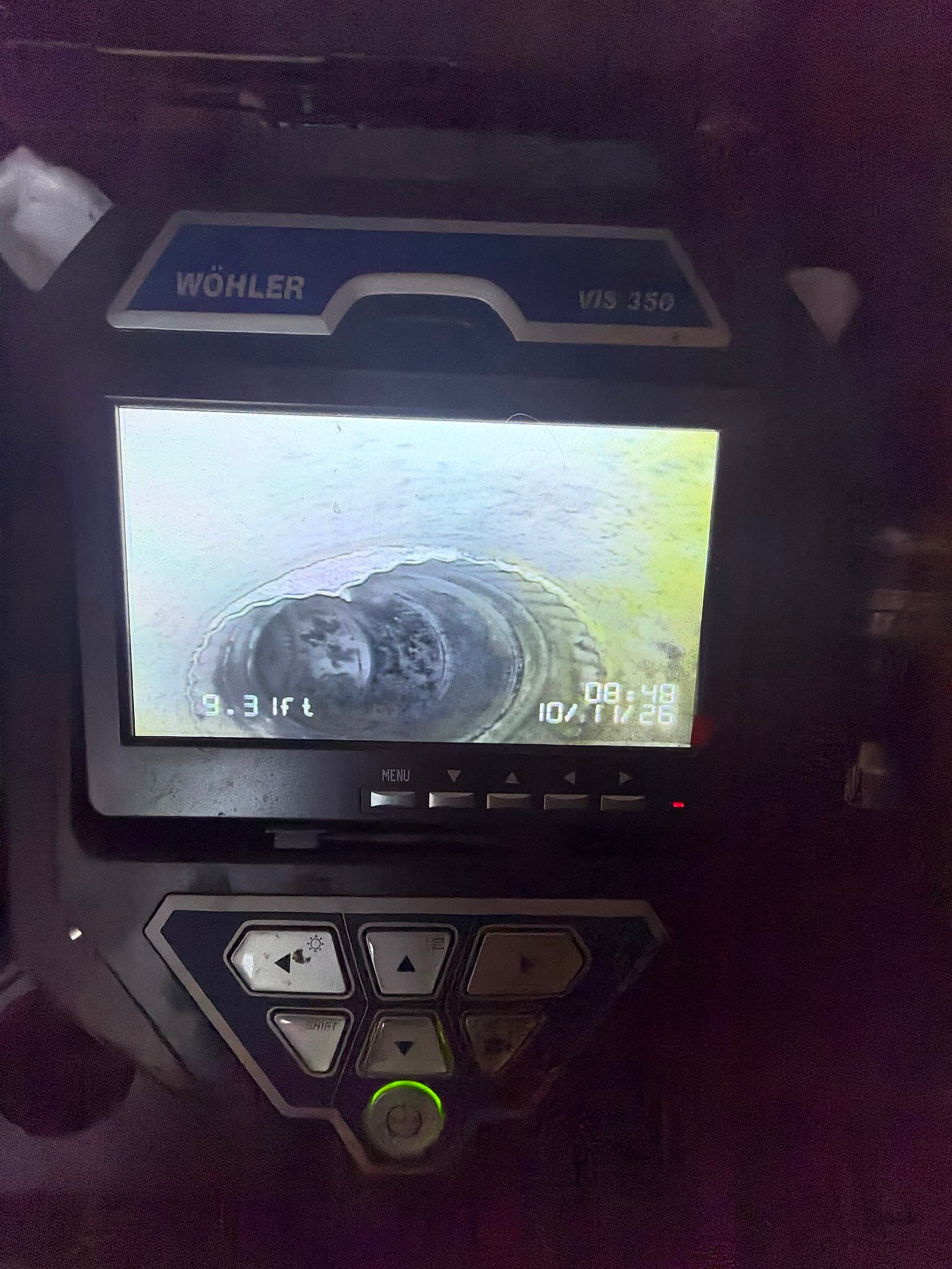 Wöhler VIS 350 inspection camera display showing the duct interior at the 9.3 foot mark, with lint residue visible coating the metal duct wall.