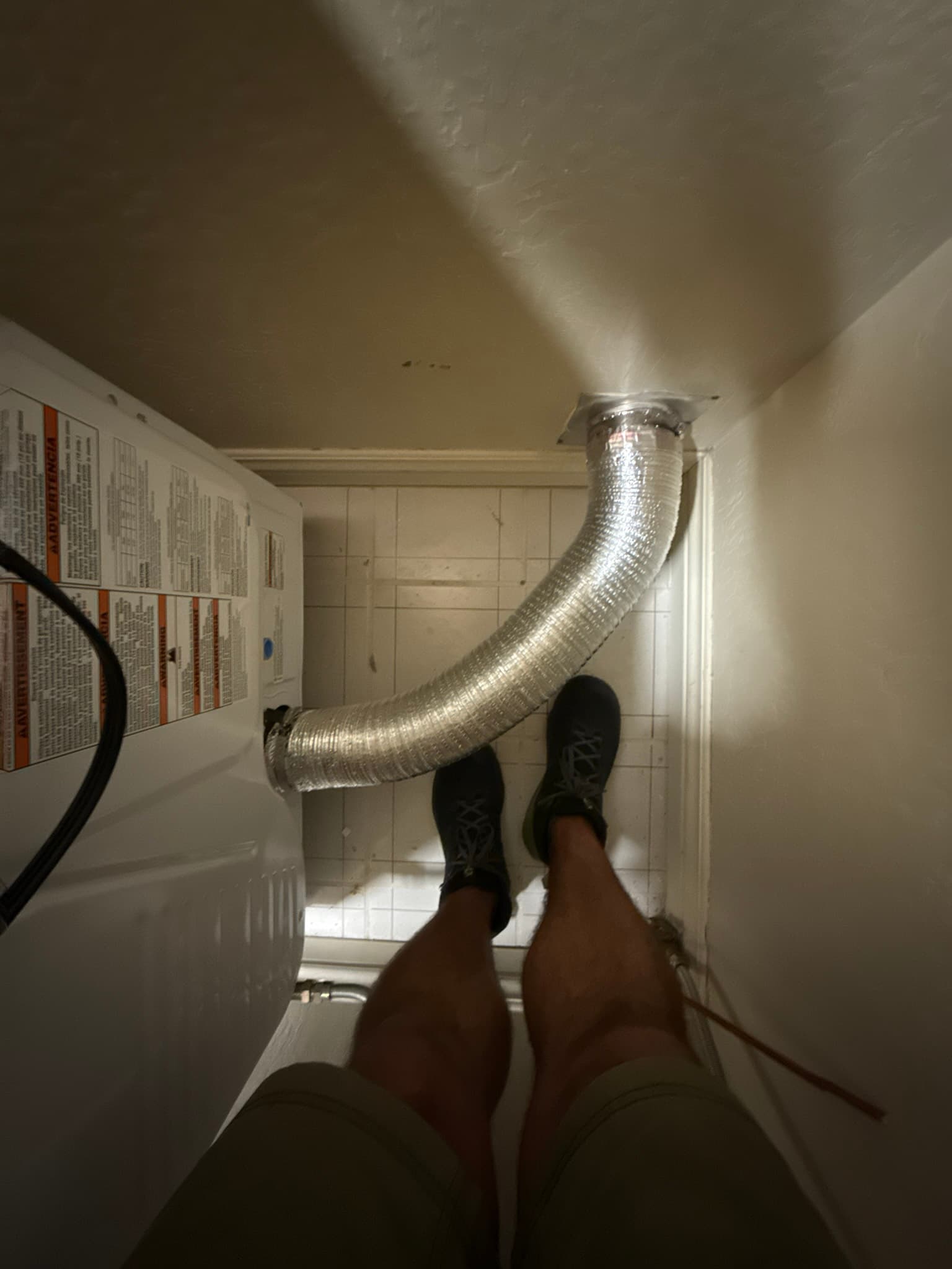 Newly installed UL 2158A-rated rigid fire duct connected as part of the dryer exhaust system upgrade in a San Francisco home