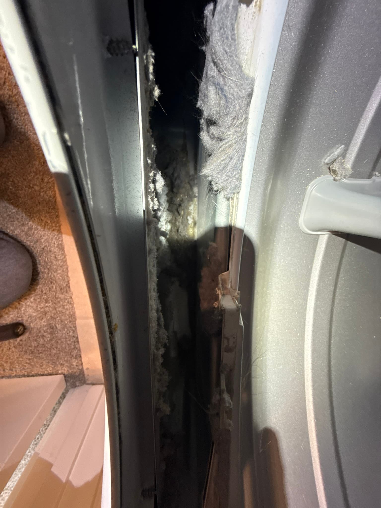 Restored dryer vent duct run showing properly connected rigid metal duct sections after booster fan removal