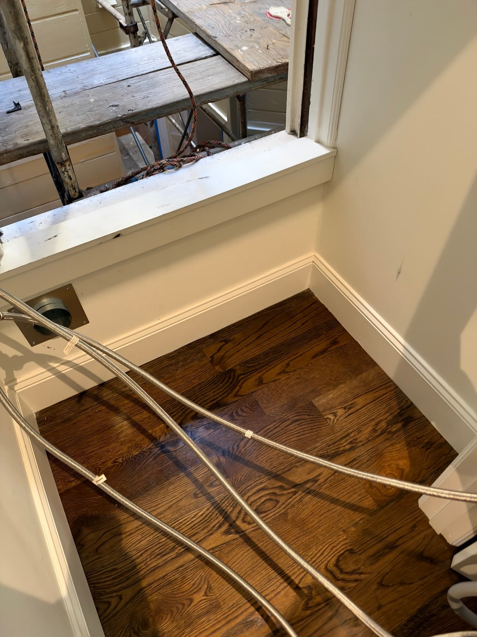 View of the exterior wall opening prepared for the new flush mount dryer vent